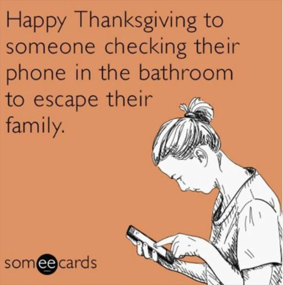 Image of a person looking at their phone captioned, 'Happy Thanksgiving to someone checking their phone in the bathroom to escape their family.'